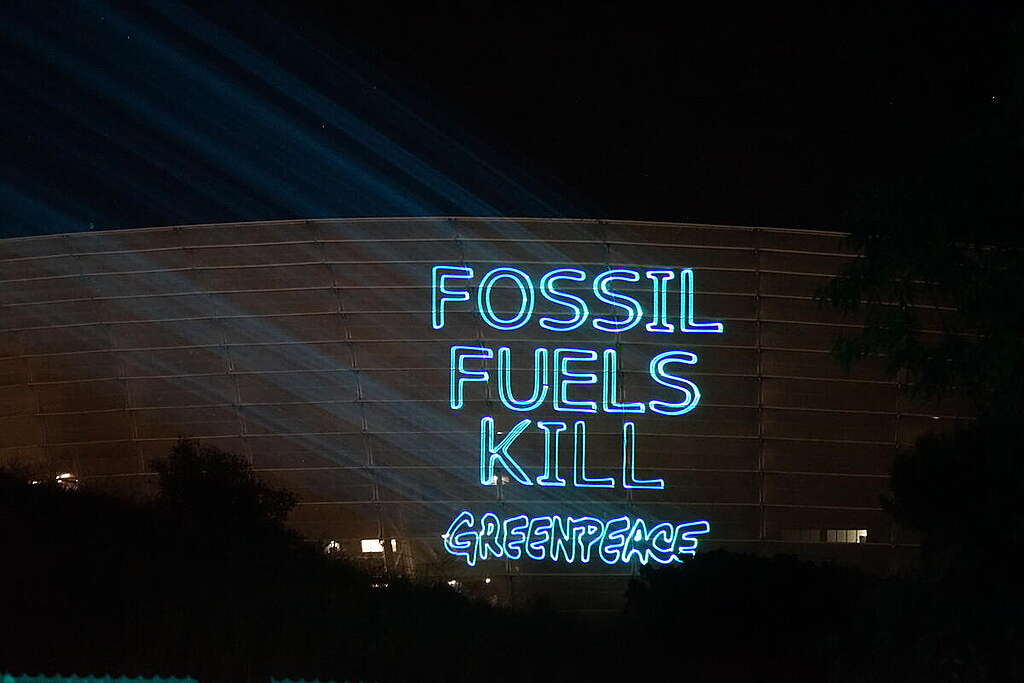 Projection onto Green Point Stadium in Cape Town, South Africa. © Awelani Mudau / Greenpeace