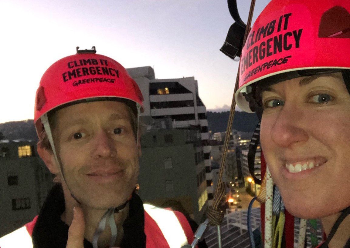 Abi and Nick on their climb up the Majestic Centre in Wellington to deliver a message OMV