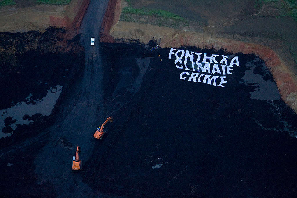 Greenpeace activists shut down a pit of a New Vale lignite coal mine near Invercargill, used by Fonterra to help fuel operations at its nearby Edendale dairy factory, labelling it a Fonterra Climate Crime.  At dawn, activists unfurled a massive 40x40 meter banner reading Fonterra Climate Crime on the ground of the opencast mine. Other activists blocked one of the entrances and locked themselves onto some of the mine's machinery.