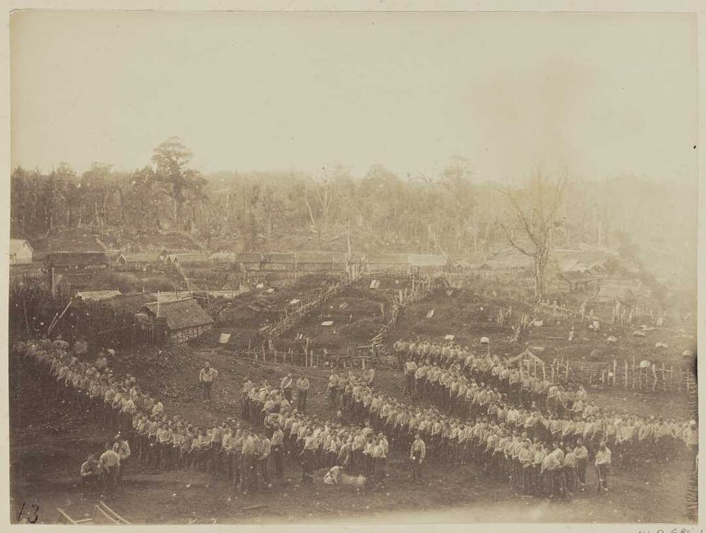 Armed constabulary awaiting orders to advance on Parihaka pā, 1881. Alexander Turnbull Library, CC BY-NC