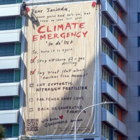 A billboard with a climate emergency to-do list