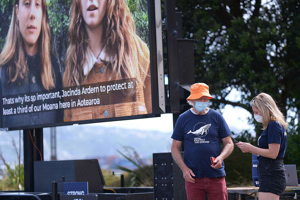 Pictured is a digital billboard playing a video of Greenpeace supporters making a plea for strong action to protect the oceans.
