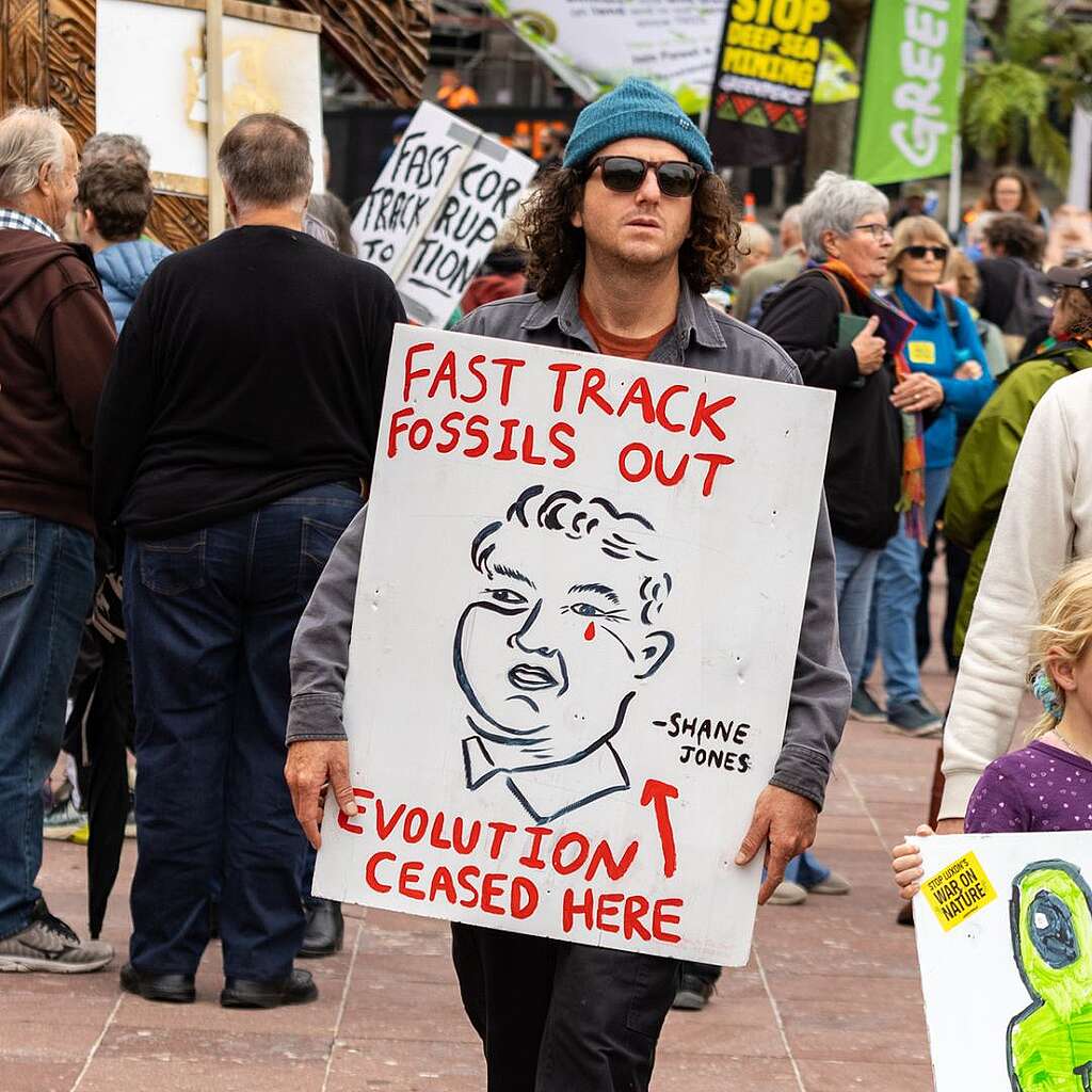Placards from the March for Nature - Fast track fossil's out - Evolution ceased here