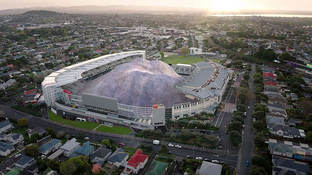A screenshot from the short CGI video released for Plastic Free July showing what the 1 billion plastic bottles sold every year in New Zealand would look like if it was poured into Eden Park Stadium.