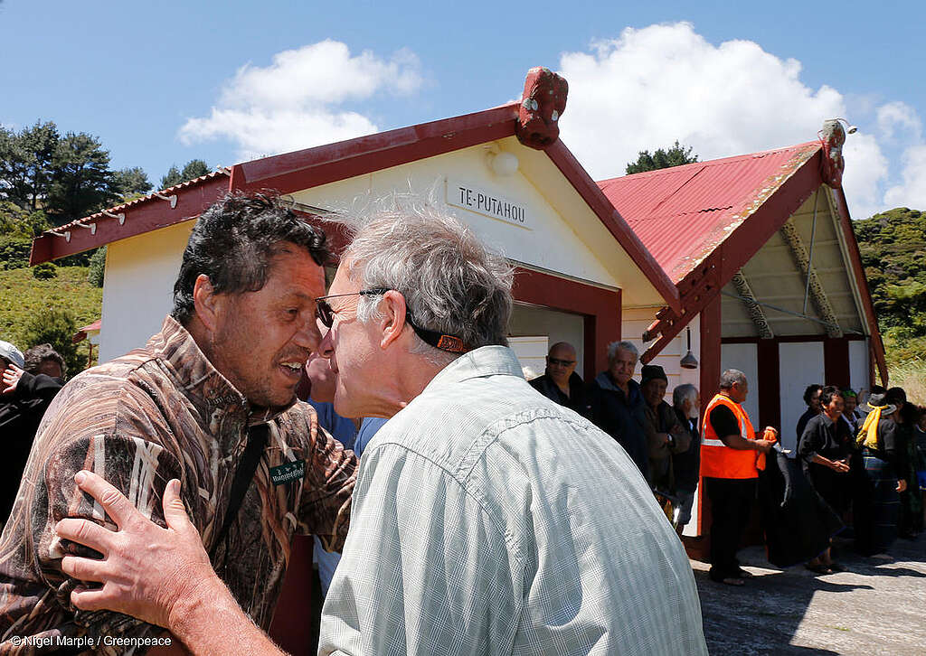 Captain of the Greenpeace ship Rainbow Warrior, Joel Stewart greets fisherman Elvis Teddy with a hongi, as the crew of the new Rainbow Warrior meet Whānau-ā-Apanui at Whangaparaoa, East Cape to celebrate the withdrawal oil giant Petrobras which had planned to drill for deep sea oil. During a 40-day at sea protest by Greenpeace and Whānau-ā-Apanui vessels, Elvis Teddy, who skippered the San Pietro fishing boat, was arrested by police. 