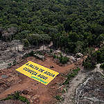 Deforestation and Water Crisis Banner in the Amazon. © Marizilda Cruppe