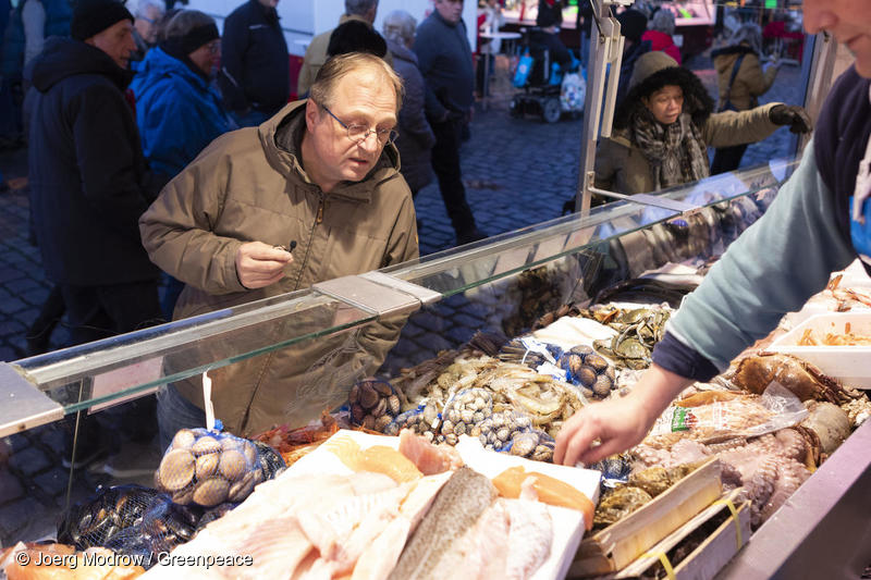 man buying seafood