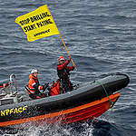 Greenpeace climate justice activists approaching Shell platform en route to major oilfield with message: ‘STOP DRILLING. START PAYING.’