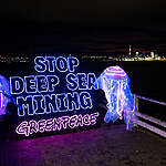 Greenpeace volunteers in Auckland hold a banner and jellyfish 'light' banner.  To highlight the irreversible damage Deep Sea Mining would cause to  the deep ocean floor – one of the last untouched ecosystems on earth,  if allowed to go ahead.

Greenpeace volunteers from around the world take part in a Global Day of Action for World Oceans Day. Calling on governments to vote against Deep Sea Mining at the July meeting at the International Seabed Authority (ISA) in Kingston, Jamaica.