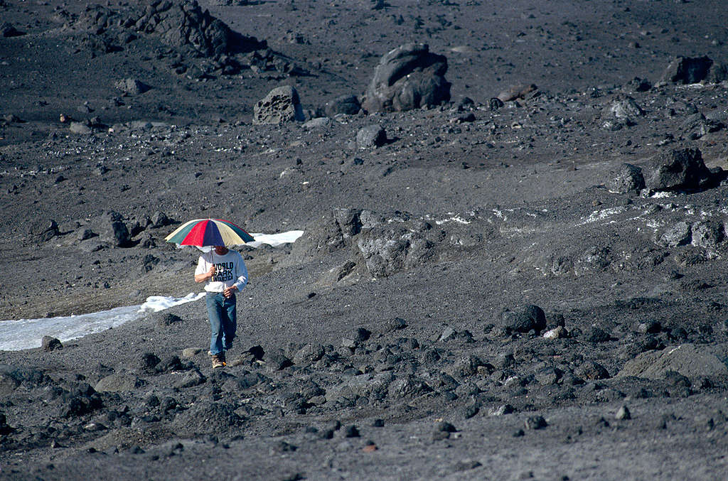 Marc Defourneaux holding Umbrella. © Greenpeace / Timothy A. Baker