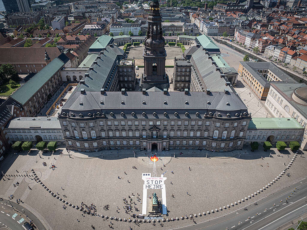 Greenpeace together with Fossil Free Future ( Fossilfri Fremmtid ) demonstrate against the Danish government's plans to open the Hejre field in the North Sea for oil exploitation. The group lay out a banner in the shape of an oil rig with the words ‘Stop Drilling, Stop Hejre’, in front of the Danish parliament building, Christiansborg, in central Copenhagen.