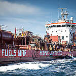 Protest at open sea against Russian oil shadow fleet

April 12 2024 - This morning activists from Greenpeace Nordic launched a peaceful protest against a bunker vessel fuelling the Russian so-called shadow fleet in open sea off the Swedish island Gotland. The activists approached the vessel in two rhibs and painted OIL IS WAR - PEOPLE WANT PEACE on the side. The 125 metre long bunker vessel Zircone operates as a floating gas station, fuelling the shadow fleet. It’s a fleet of several hundred rusty tankers that are often worn out and old, missing inspections, have dubious insurance if any at all, obscure ownership and are registered in countries with lax regulations., Oil Fuels War - Protest at sea