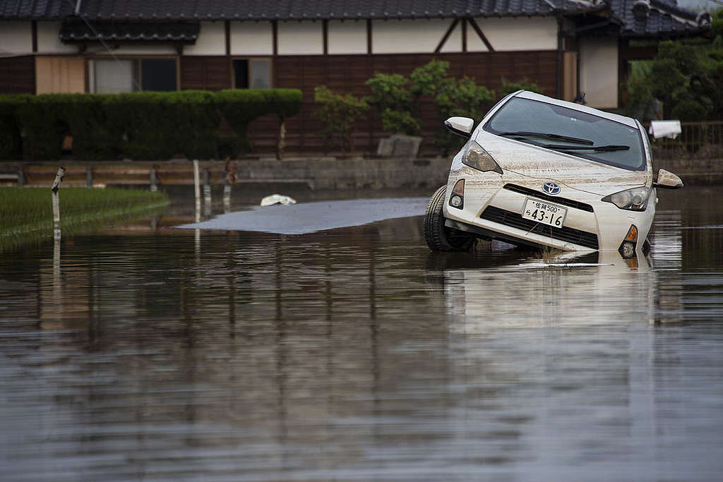 A Toyota car stranded and damaged by a flood in Japan