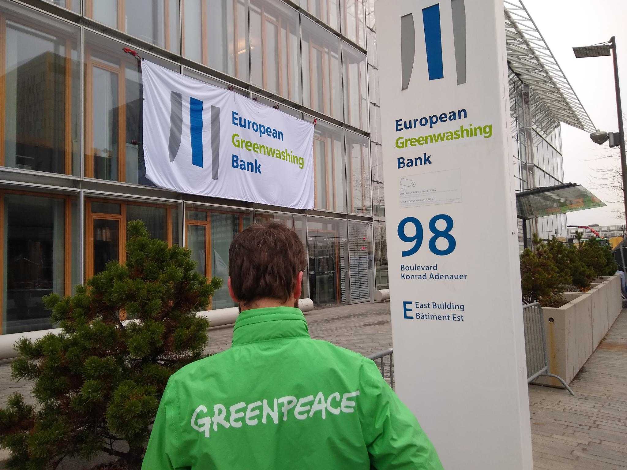 Activists rebrand EIB as European Greenwashing Bank - Greenpeace European  Unit