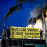 Greenpeace France activists unfurl banners reading "Nuclear energy: Climate distraction" in front of the Château de la Muette, in Paris. 
They then sounded off anti-intrusion devices on the roof of the building.
Devant le Château de la Muette, des activistes de Greenpeace France ont brandi ce matin des banderoles sur lesquelles était écrit “Nuclear energy : Climate distraction” ou encore “Nucléaire : diversion climatique”. Ils ont ensuite lancé des dispositifs sonores anti-intrusion sur le toit du bâtiment.