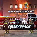 Hours before the start of COP28, Greenpeace Canada activists and supporters stand alongside a projection of the mass devastation caused by forest fires on Environmental Minister Steven Guilbeault’s office in Montreal, as a fire truck serves as a stark reminder of this summer’s wildfire season. “Make Polluters Pay” shines bright as Greenpeace is denouncing the fossil fuel industry's role in exacerbating the climate crisis, and specifically extreme weather like wildfires. Greenpeace is demanding the federal government introduce a climate damages tax on the Canadian fossil fuel industry to finance the UN Loss & Damage fund, and ensure communities hit hardest by the climate crisis will receive the essential assistance they need.