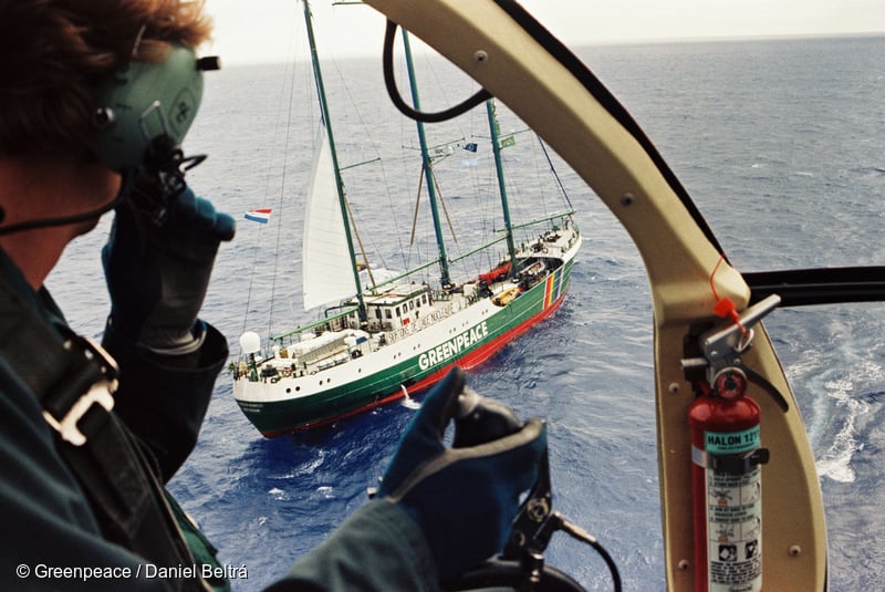 MV Greenpeace’s helicopter flying over SV Rainbow Warrior II near the French Government’s nuclear test site at Moruroa Atoll