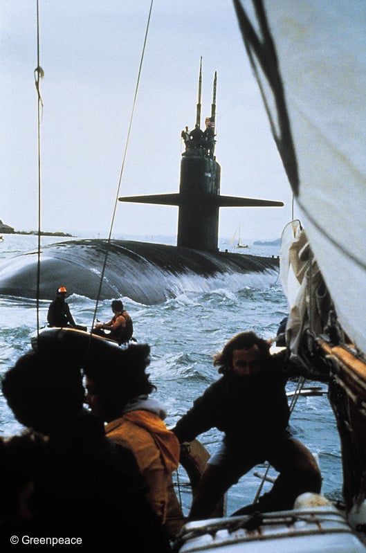 Skipper Chris Robinson on board SV Vega during an at-sea protest by the Auckland Peace Squadron against the visit of the USS Phoenix nuclear submarine to Auckland on 9 November 1983. The photo shows the Greenpeace boat maneuvering itself in front of the US nuclear submarine.

Making Waves contains a contemporary first-hand account of that protest by Greenpeace Campaigner Susan-Jane Owen. On board SV Vega that day were Chris Robinson, Anna Horne, Elaine Shaw, Carol Stewart, Tom Donahue, Hilari Anderson, and Susan-Jane Owen of Greenpeace, and Hilda Halkyard-Harawira and Grace Roberston of the Pacific Peoples' Anti-Nuclear Action Committee (PPANAC)