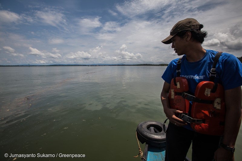 Greenpeace campaigner Ahmad Ashov Birry monitoring the area of oil spill about 10 kilometres from the pipe leaked location in Balikpapan Bay, East Kalimantan. An oil spill off Balikpapan bay in Borneo island that led to five deaths and the declaration of a state of emergency was caused by a burst of undersea pipe belongs to Indonesia's state oil company Pertamina