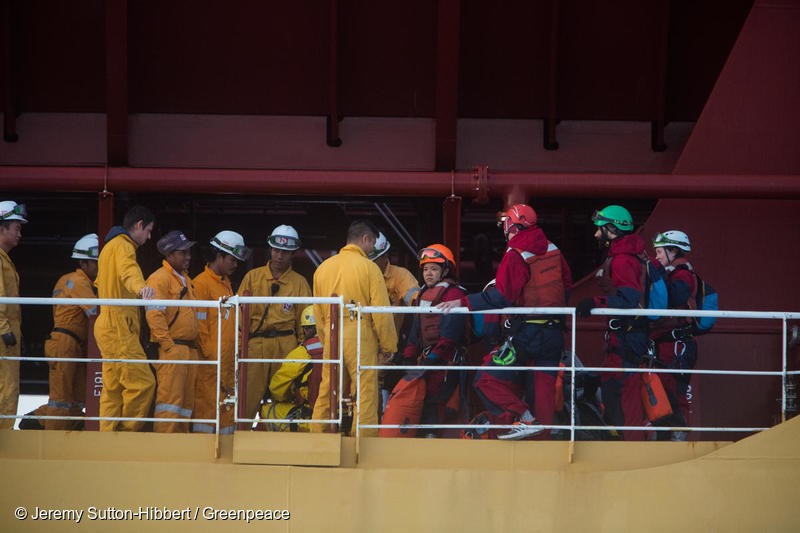 Atlantic Ocean, on 17 November 2018. - Crew members of the Stolt Tenacity tanker ship confront six Greenpeace activists who boarded the giant tanker ship carrying dirty palm oil from Indonesia to Europe in a peaceful protest against rainforest destruction.Trained Greenpeace climbers from Indonesia, Germany, the UK, France, Canada and the US, have safely scaled the side of Stolt Tenacity and aim to stay on board until it arrives at its final destination in Rotterdam.The 185-metre long cargo ship is loaded with palm oil from Wilmar, the largest and dirtiest palm oil trader in the world.