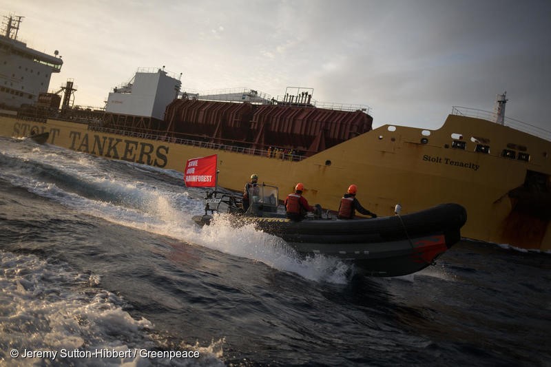 Atlantic Ocean, on 17 November 2018. - Six Greenpeace activists have boarded a giant tanker ship carrying dirty palm oil from Indonesia to Europe in a peaceful protest against rainforest destruction.Trained Greenpeace climbers from Indonesia, Germany, the UK, France, Canada and the US, have safely scaled the side of Stolt Tenacity and aim to stay on board until it arrives at its final destination in Rotterdam.The 185-metre long cargo ship is loaded with palm oil from Wilmar, the largest and dirtiest palm oil trader in the world.