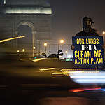  A Greenpeace activist holds a placard reading "Our lungs need a clean air action plan". Amid the national health emergency faced by India, due to hazardous air pollution levels, Ministry of Environment, Forest and Climate Change’s response to a question in Rajya Sabha raises hopes of breathable India in near future. Greenpeace India welcomes the National Clean Air Program (NCAP) formulated to fight air pollution crisis in the country. ©Saagnik Paul/Greenpeace
