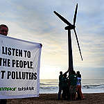 Greenpeace and Tcktcktck volunteers raise a wind turbine on the beach at dawn in Durban, South Africa. To send a message of hope for the latest round of UN climate change talks opening here on Monday. Campaigners say Durban must be a new dawn for the international negotiations to agree a fair, ambitious and legally binding treaty to avert climate chaos. They are demanding that politicians stop listening to the polluting corporations and listen to the people who want an end to our dependence on fossil fuels. Africa is on the front line of dangerous climate change, with millions already suffering the impacts through increased drought and extreme weather events, threatening lives and food security.