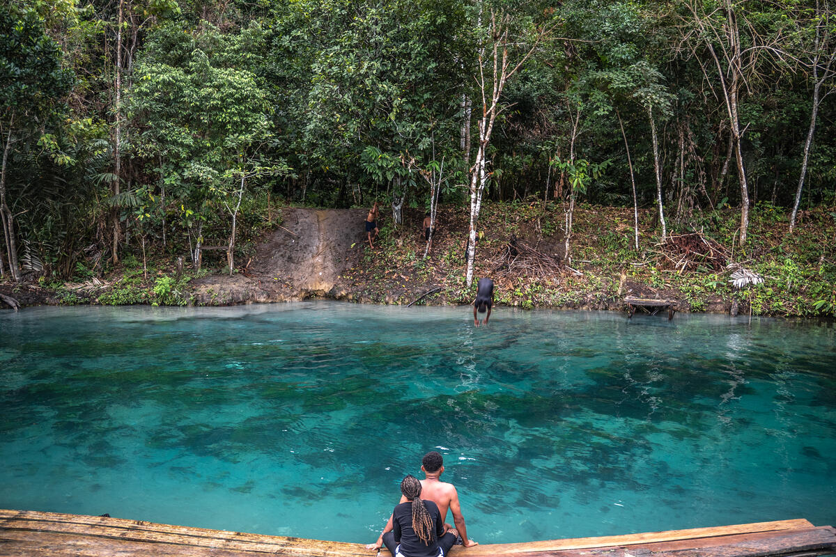 People by the Blue River in Berab, Jayapura. © Jurnasyanto Sukarno / Greenpeace