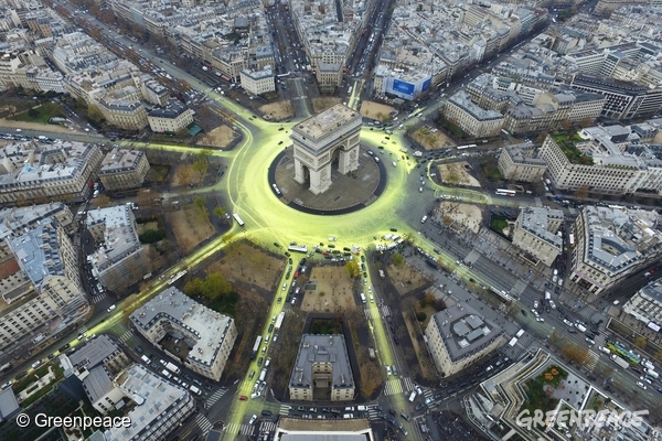 COP21: Arc de Triomphe Sun Action in Paris.