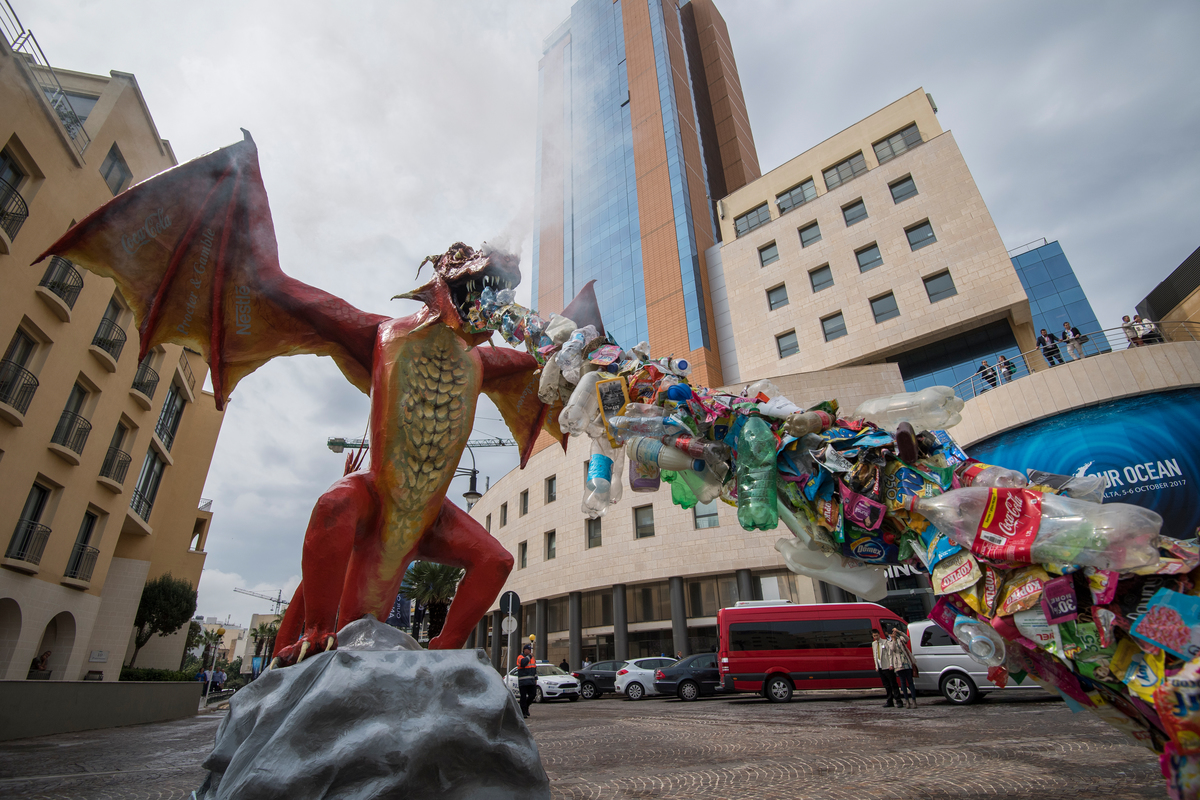Plastic-Spitting Dragon Protests at Our Oceans Conference in Malta. © Bente Stachowske / Greenpeace