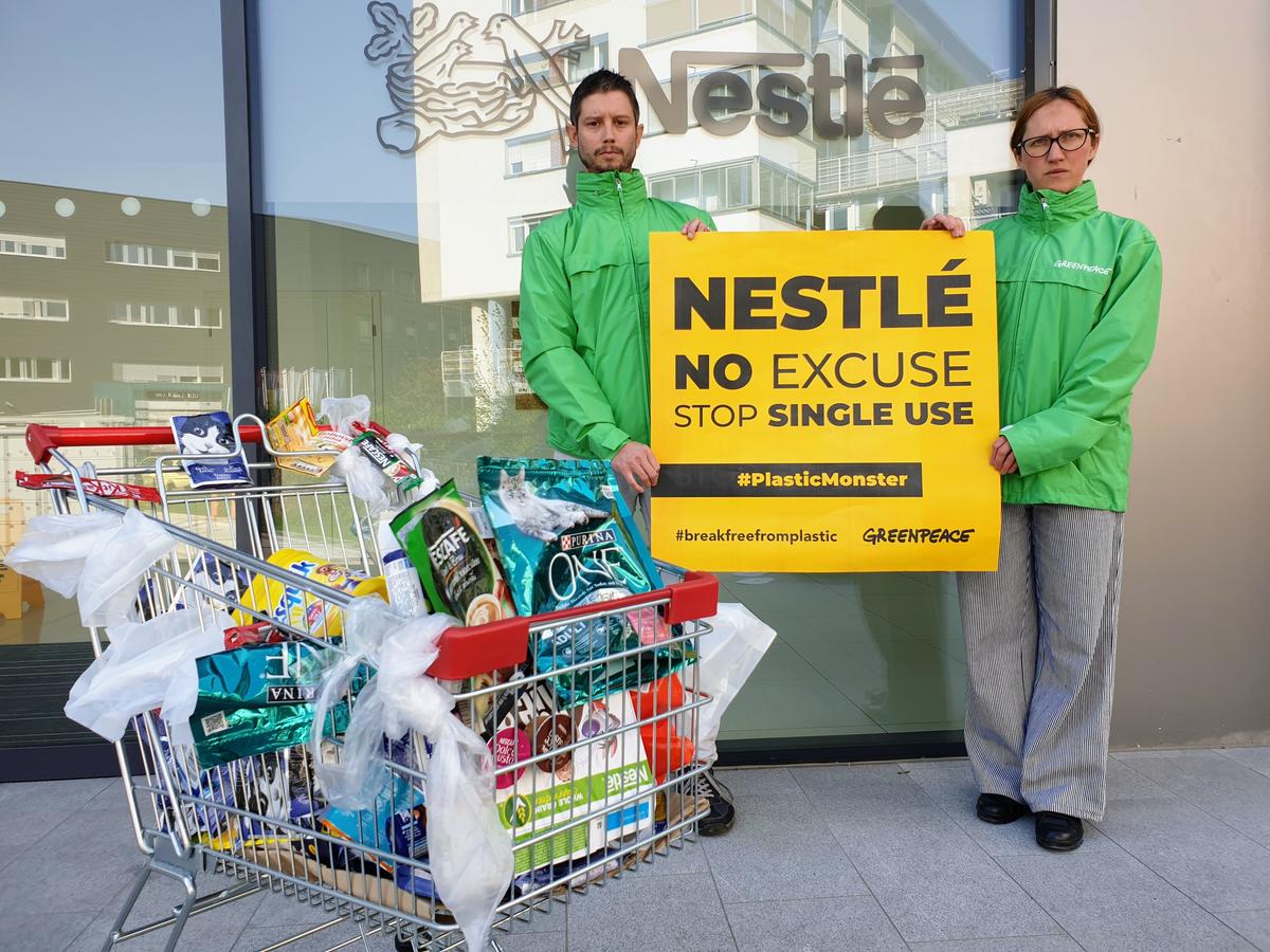 Plastic Monster Action at Nestlé Office in Slovenia. © Katja Hus / Greenpeace