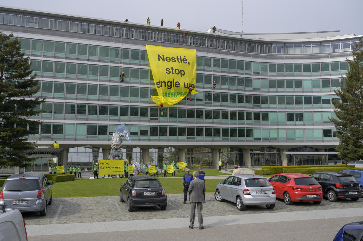 Plastic Monster Action at Nestlé Headquarters in Switzerland. © Greenpeace / Flurin Bertschinger