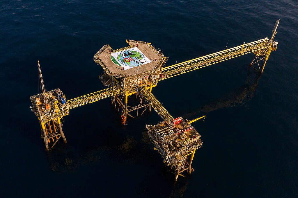 Project North Sea: Activists Reveal Art Piece Banner on Oil Rig in Denmark. © Andrew McConnell / Greenpeace