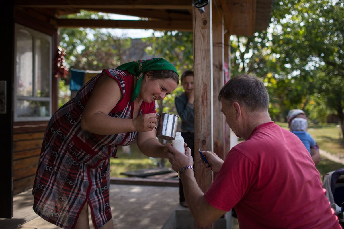 Taking Milk Samples in Ukraine. © Denis Sinyakov / Greenpeace