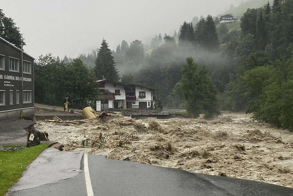A damaged street is seen in Kelchsau near Kitzbuehel, Austria after heavy rainfall caused damaging floods and mudslides. © Zoom Tirol/AFP via Getty Images