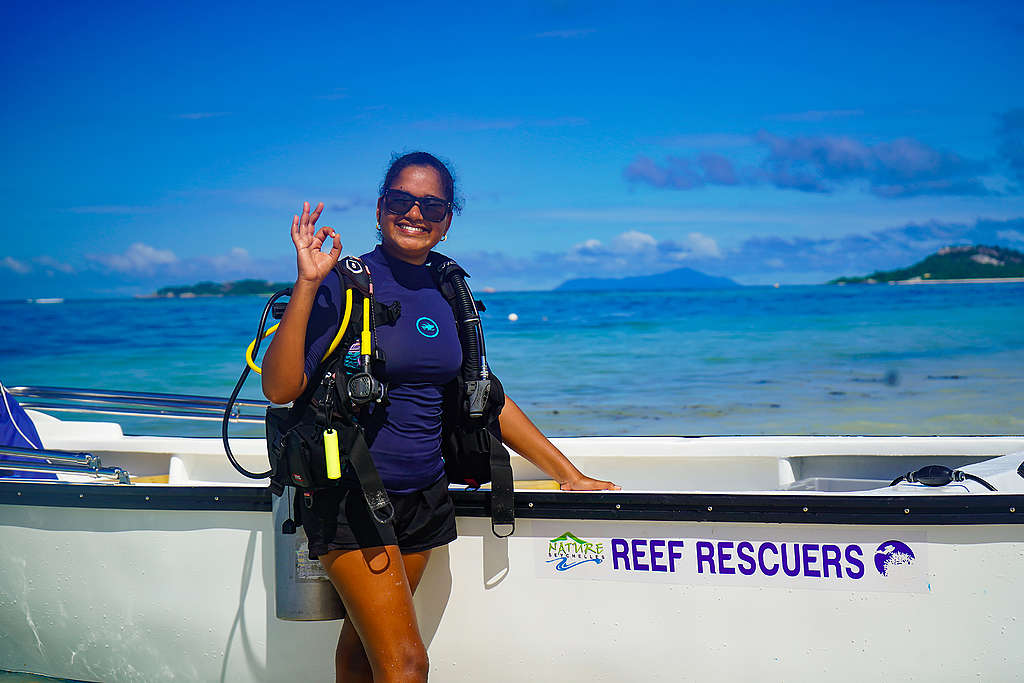 25-year old Athina Antoine, sunglasses and dark blue swim top and shorts, has been a part of the Nature Seychelles’ Reef Rescuers (white boat) team since 2017  © Frankie Rignace