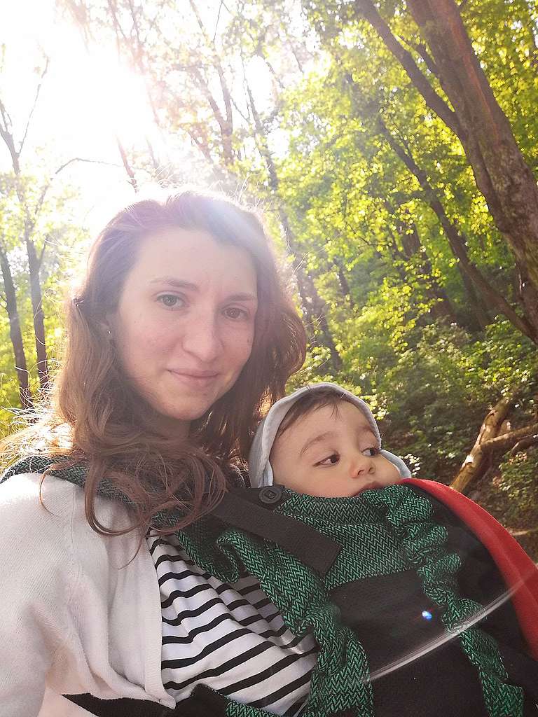 Antonia Macsim with her child in Brașov, Romania. As part of the #MobilityForAll campaign, Antonia shares their story of city life. 