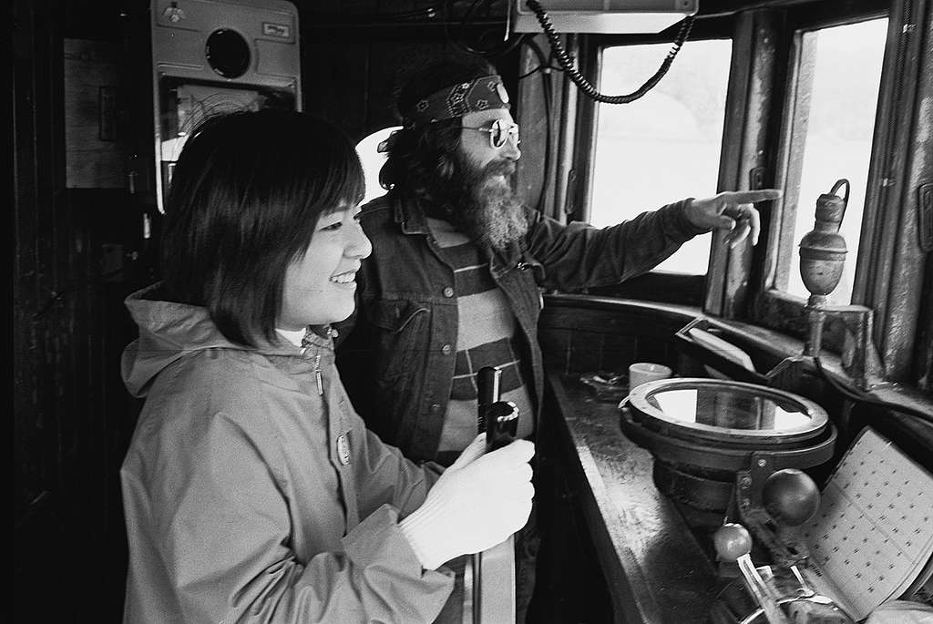 Taeko Miwa and Melville Gregory in the wheelhouse of the Phyllis Cormack, the first Greenpeace ship, 1975. © Greenpeace / Rex Weyler