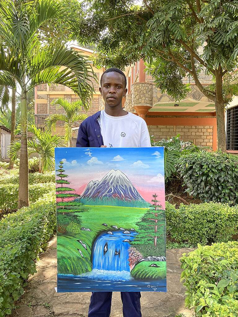Denzel Juma with his painting at Ubunifu Hub, Nairobi © Gerance Mutwol 