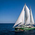 Drone aerial of the Rainbow Warrior under sail in the Indian Ocean during the 'Beyond Seafood' campaign.