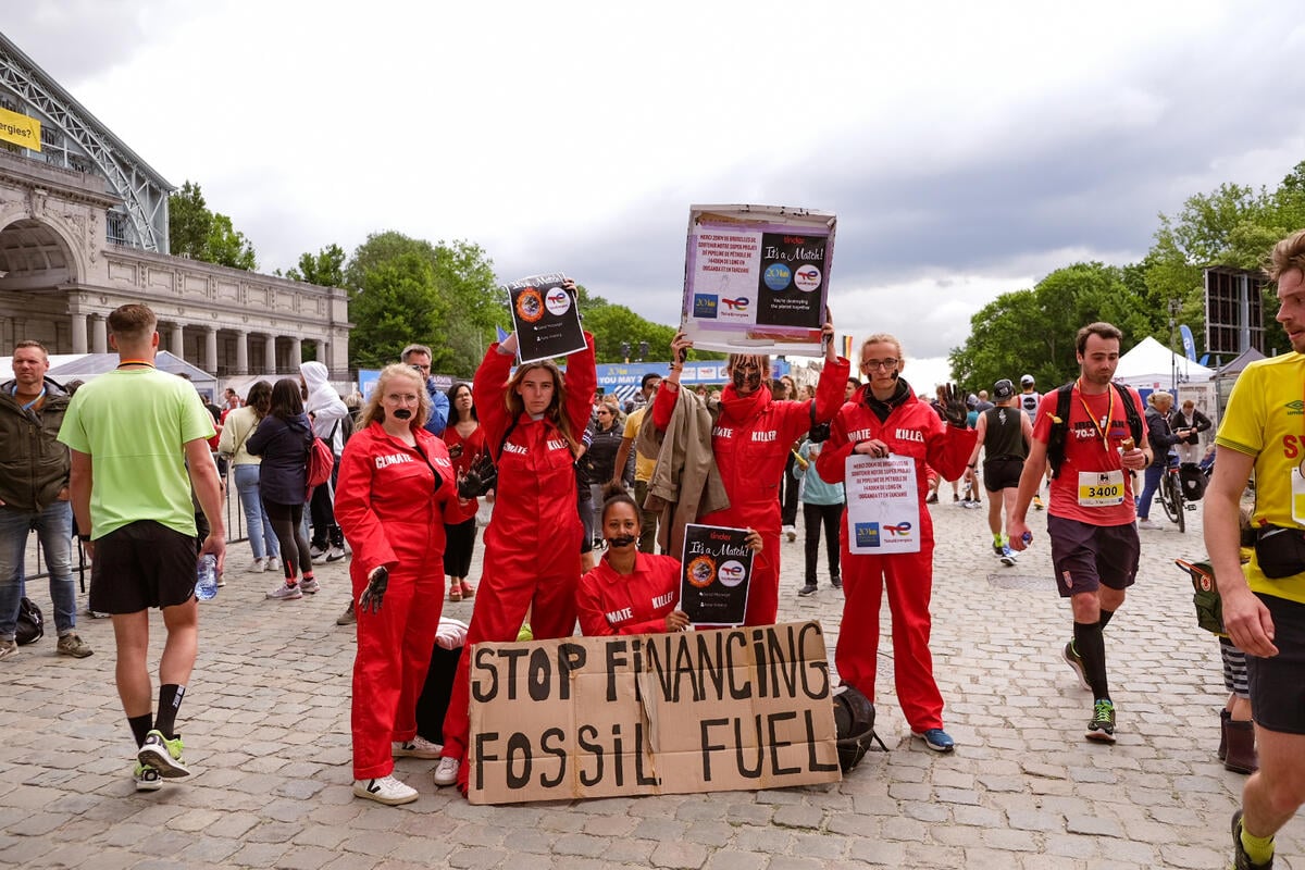 Action against TotalEnergies' Toxic Sponsorship of '20km of Brussels' Race. © Betty Matthysen / Greenpeace