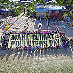 Coastal community demands accountability for climate damages in Dinagat Islands, Philippines.