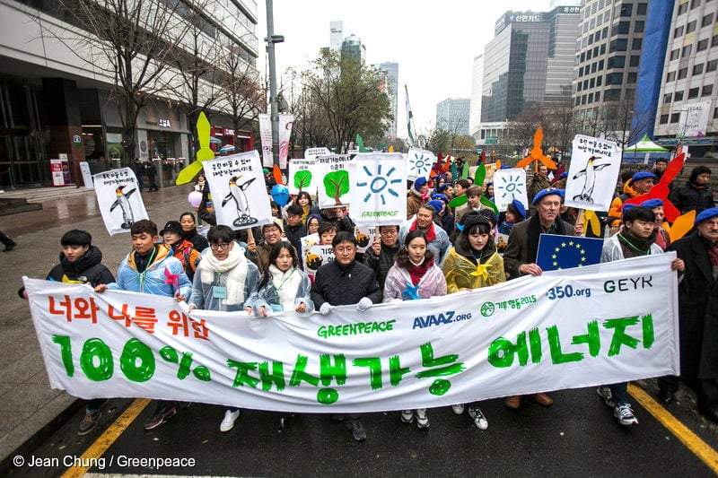 Participants in the Global Climate March walk on the Cheonggye Street in downtown Seoul. One thousand people take to the street, and join the peace march demanding the global leaders to reach a new global climate agreement at the Paris Climate Summit. Over the world, on the eve of the summit, hundreds of thousands of people, almost in 150 countries, join the Global Climate March.Greenpeace forms a coalition force for the Global Climate March with civil society groups, local and international environmental organisations such as Avaaz, ClimateAction2015, Green Environment Youth Korea and 360.org.