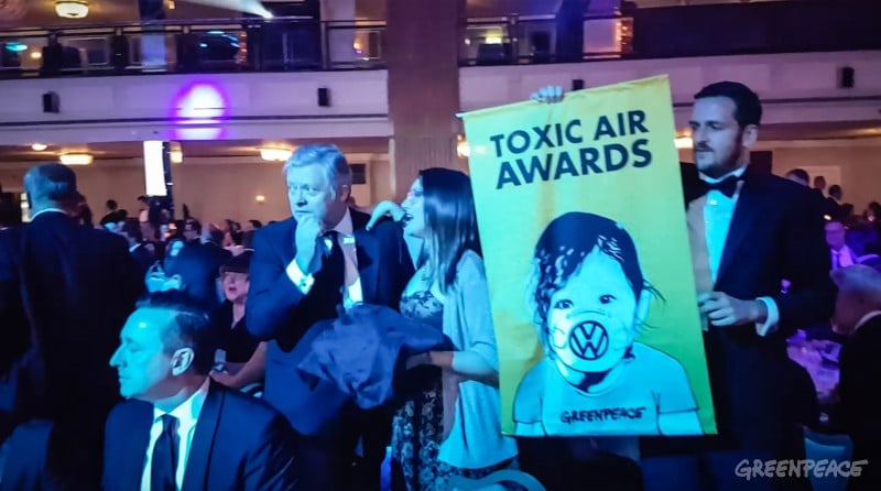 Volkswagen receive ‘toxic air award’ at SMMT annual dinner.Air pollution campaigners embarrassed senior executives from Volkswagen this evening by presenting them with an award for their contribution to toxic air at an exclusive dinner at The Grosvenor Hotel, hosted by The Society of Motor Manufacturers and Traders’ and attended by over 1,000 guests from industry, government and the media.The campaigners, from Greenpeace, announced the award over loudspeaker to guests, before campaigners approached VW’s table, handing Paul Willis the award.