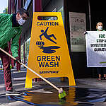 Greenpeace Luxembourg activists place two human-sized yellow signs with the message “Caution - Greenwash” at the main entrance of the Luxembourg national pension fund’s headquarters, to protest continued investment in fossil fuels.

Known as Fonds de Compensation (FDC), Luxembourg’s pension fund claims to conduct sustainable and socially responsible investments, yet provided more than half of a billion Euro to oil, gas and coal companies like Shell, BP, Total and Chevron during 2019. Greenpeace Luxembourg criticized the greenwashing tactics and demanded immediate measures from Parliament and the government to ensure the withdrawal of public funds entrusted to the FDC from fossil fuel corporations.