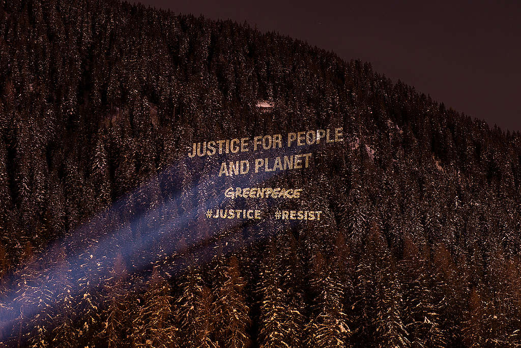 Greenpeace Justice Activity at the World Economic Forum in Davos. © Lumina Obscura
