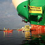 Activists with Banners - Forest Action Against Antares Freight Ship (Finland: 2007). © Greenpeace / Patrik Rastenberger