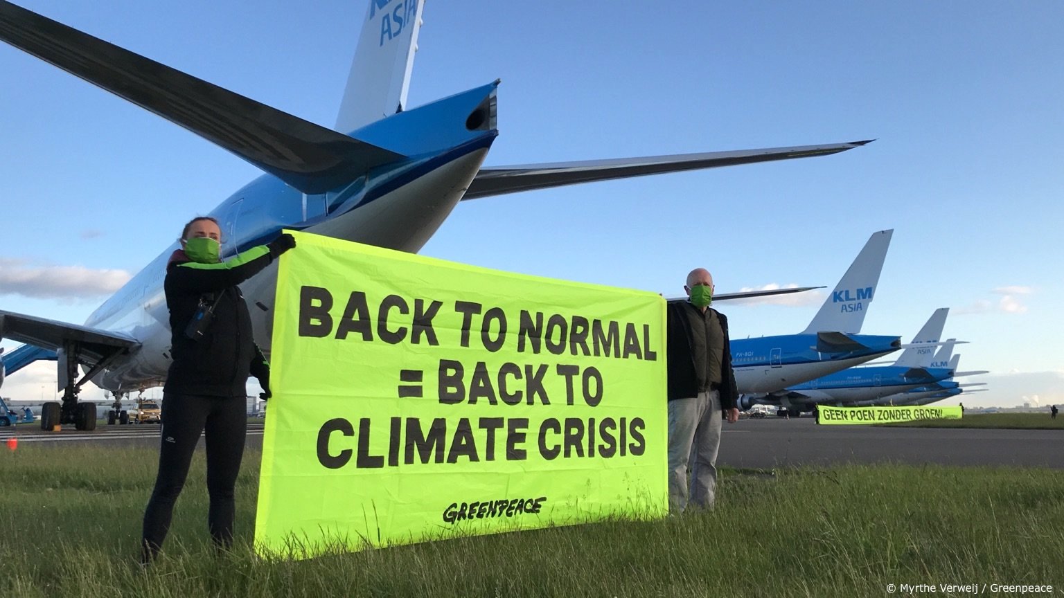 Activists cycle on airport runway demanding climate conditions for