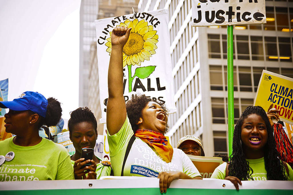 ‘What do we want? Climate justice! When do we want it? Now!’ 