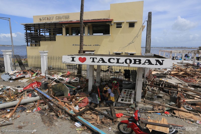 A family takes a rest under a waiting shed in Tacloban City after it was hit by Typhoon Haiyan last Saturday.